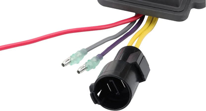 Close-up of a regulator rectifier with multicolored wires and black connector plug for marine outboard engine.