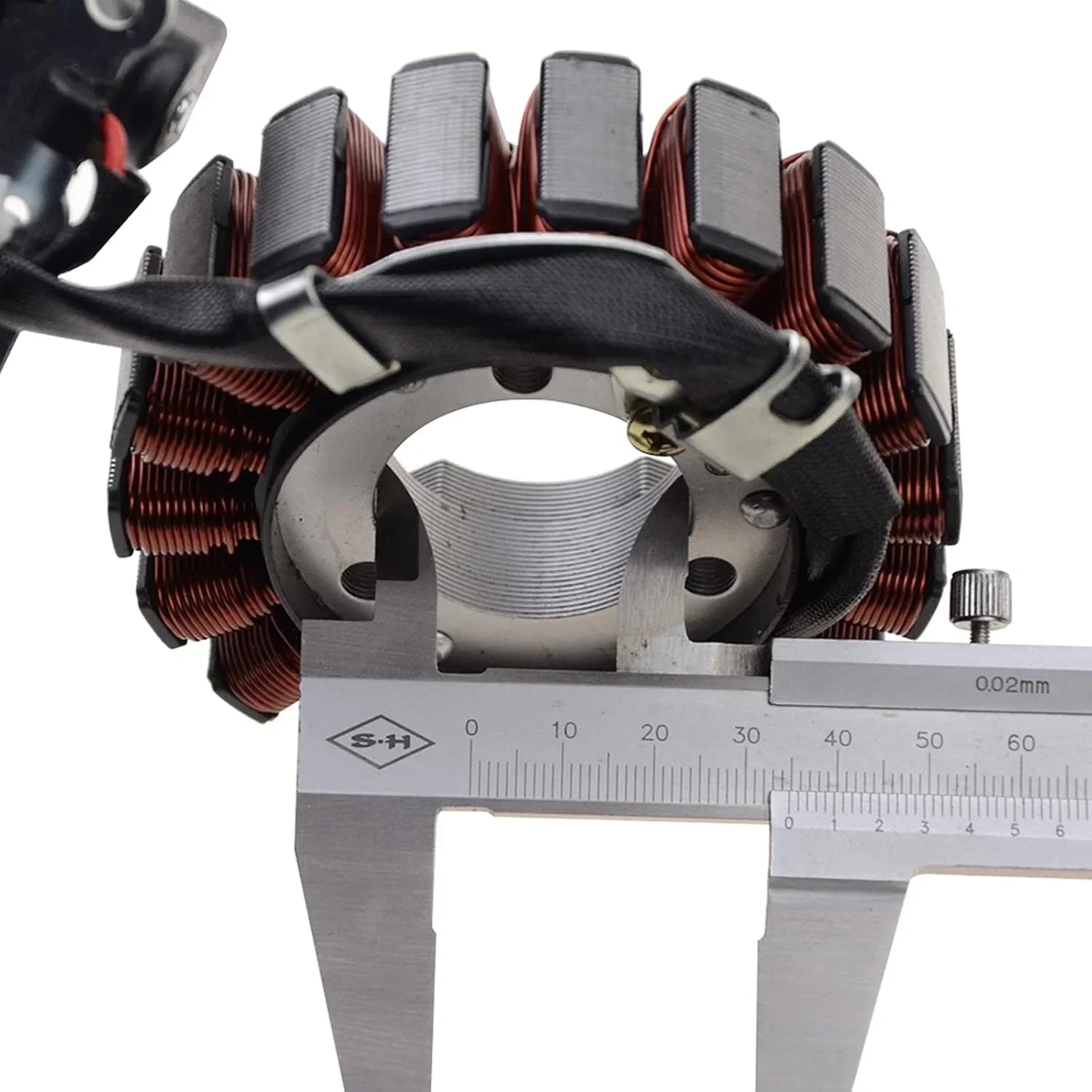 Close-up of a motorcycle stator magneto with caliper measuring diameter