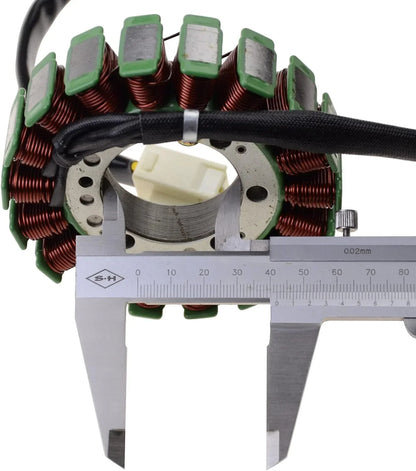 Kawasaki Z1000 motorcycle stator with copper coils and caliper measuring diameter