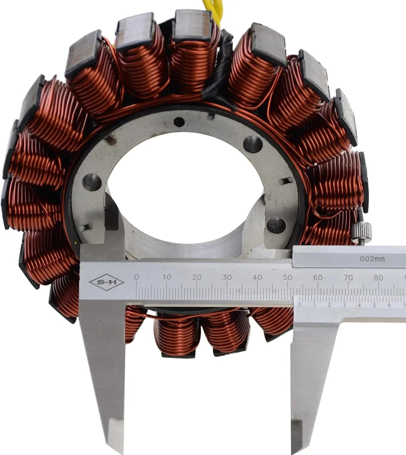 Honda NC700 stator coil with copper windings, measured with a caliper, close-up view