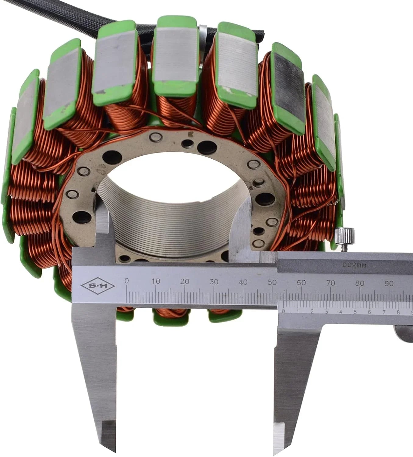 Motorcycle stator magneto coil with caliper measuring diameter, copper windings visible