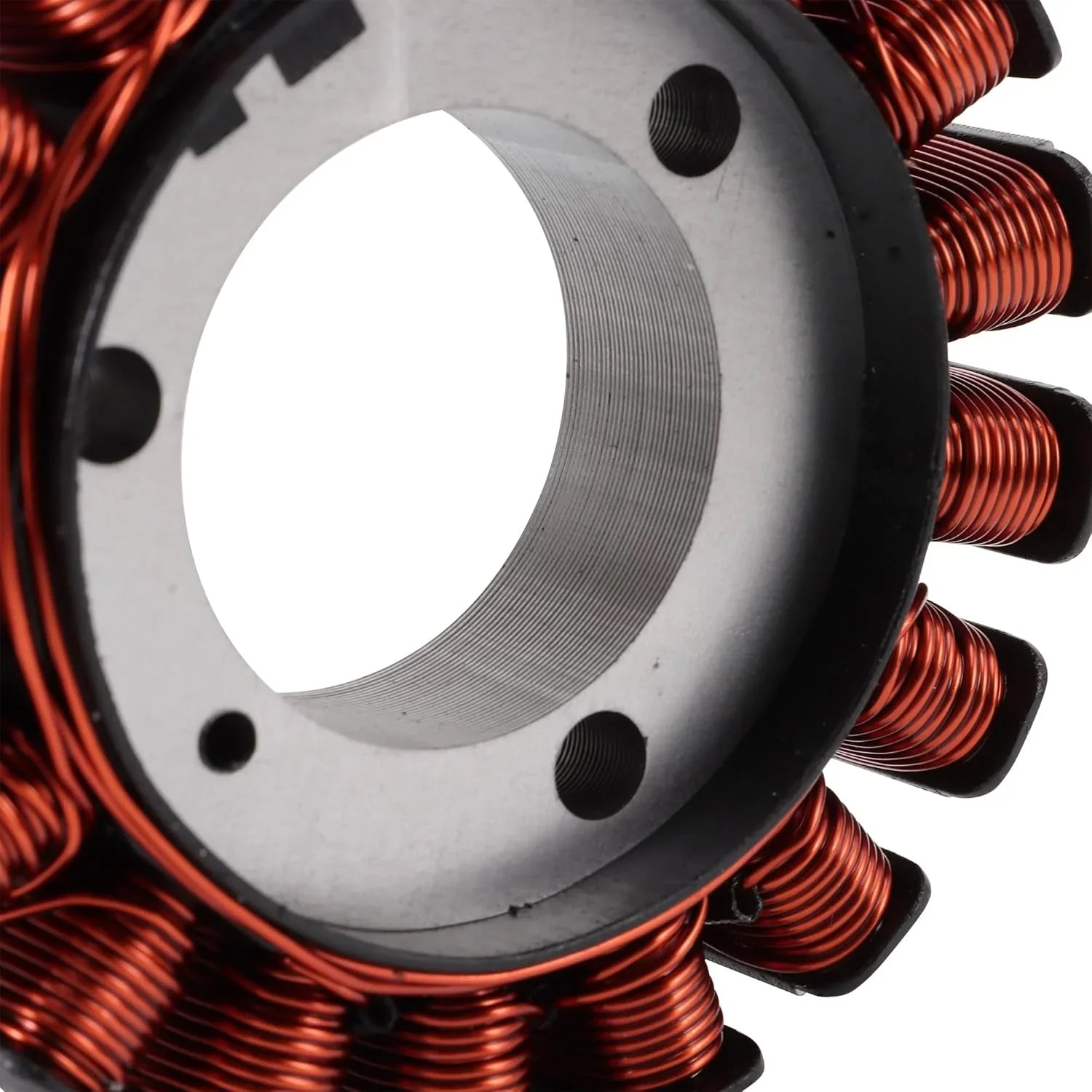 Close-up of motorcycle stator coil with copper windings for Yamaha FZ16 engine.